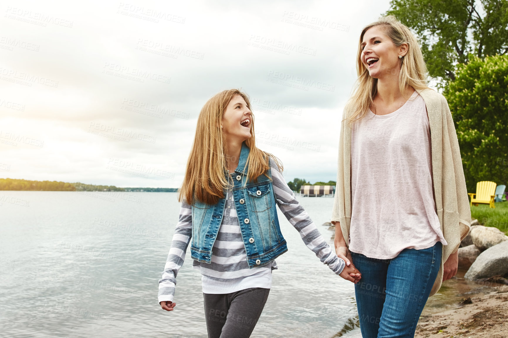 Buy stock photo Family, holding hands or lake with mother and daughter outdoor in nature together for bonding. Love, summer or walking with woman and girl child by water in park for security, support or trust