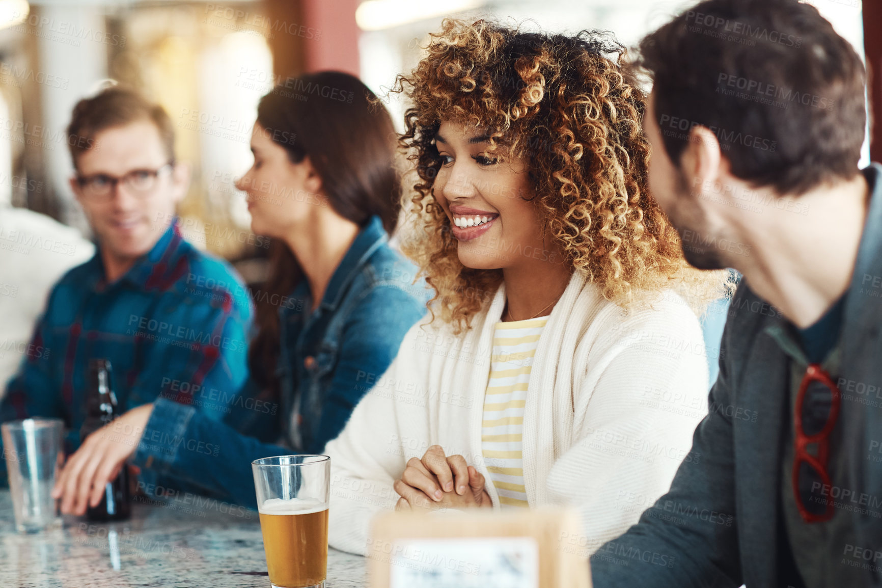 Buy stock photo Shot of a couple enjoying a drink at a bar