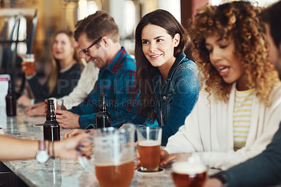 Buy stock photo Shot of people enjoying a drink at a bar