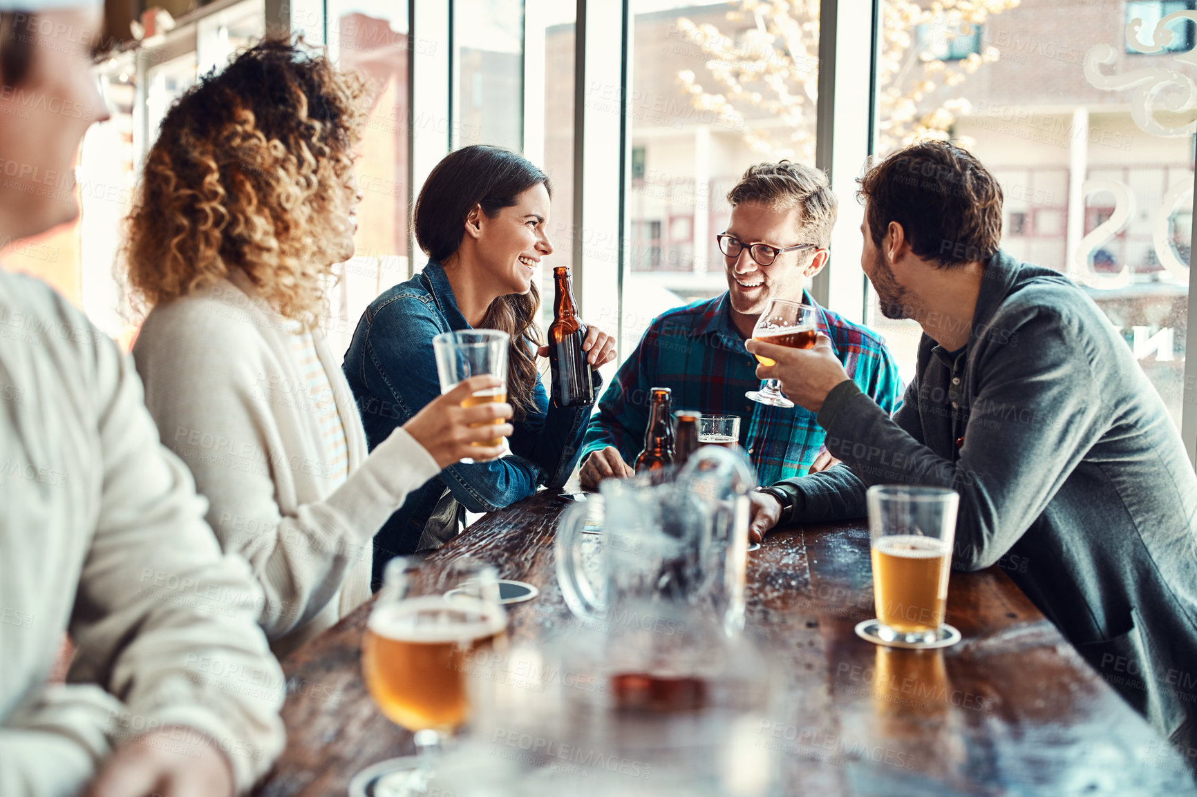 Buy stock photo Restaurant, beer and friends with smile in celebration of birthday event in urban New York pub. Group of people at hangout for happiness and gathering together with alcohol beverage at summer lunch