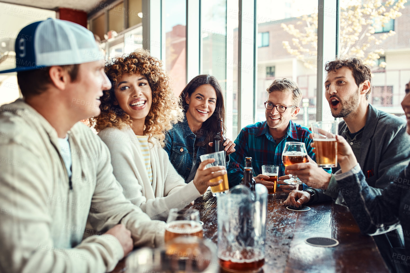 Buy stock photo Restaurant, beer and group of friends at hangout in celebration of birthday event in urban New York bar. People with smile for happiness and gathering together with alcohol beverage at summer lunch