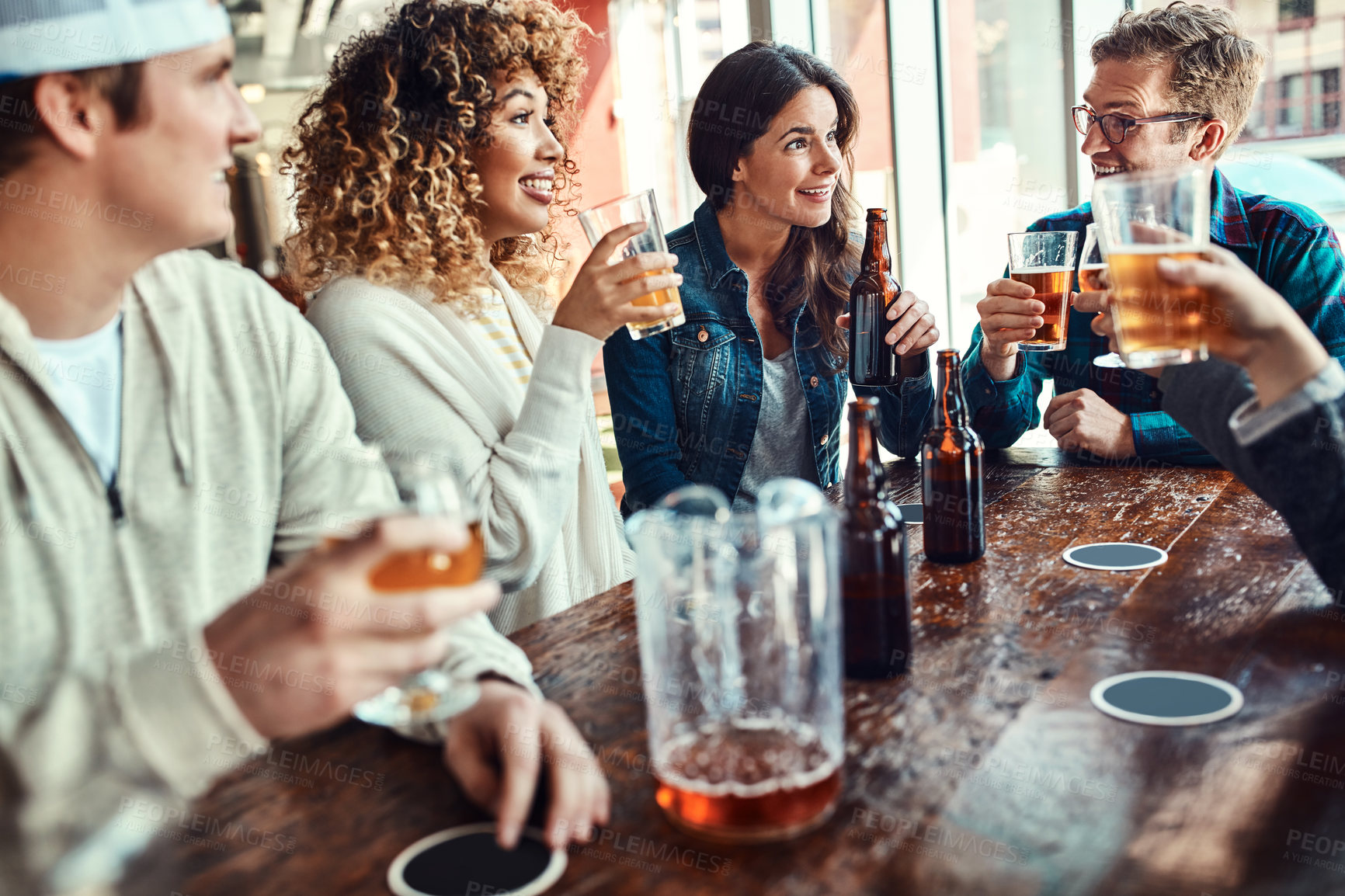 Buy stock photo Restaurant, beer and gen z friends at hangout in celebration of birthday event in urban New York bar. Group of people with smile for happiness and gathering together with alcohol beverage at lunch