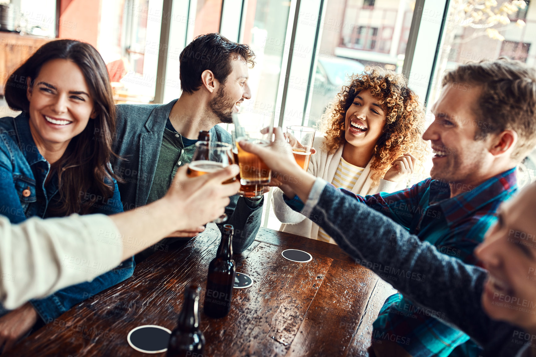 Buy stock photo Friends, people and toast in pub for beer with laugh for reunion, social gathering and date. Bar, relationship and happy with glass for drinking alcohol for fun, bonding and together with support