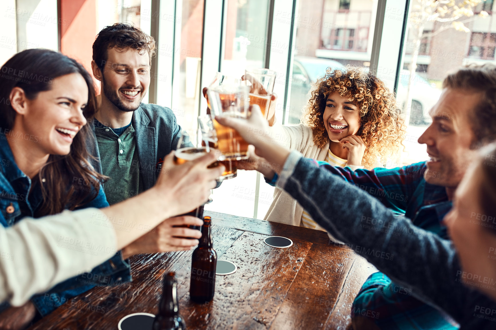 Buy stock photo Friends, people and toast in pub for beer with smile for reunion, social gathering and date. Bar, relationship and happy with glass for drinking alcohol for fun, bonding and together with support