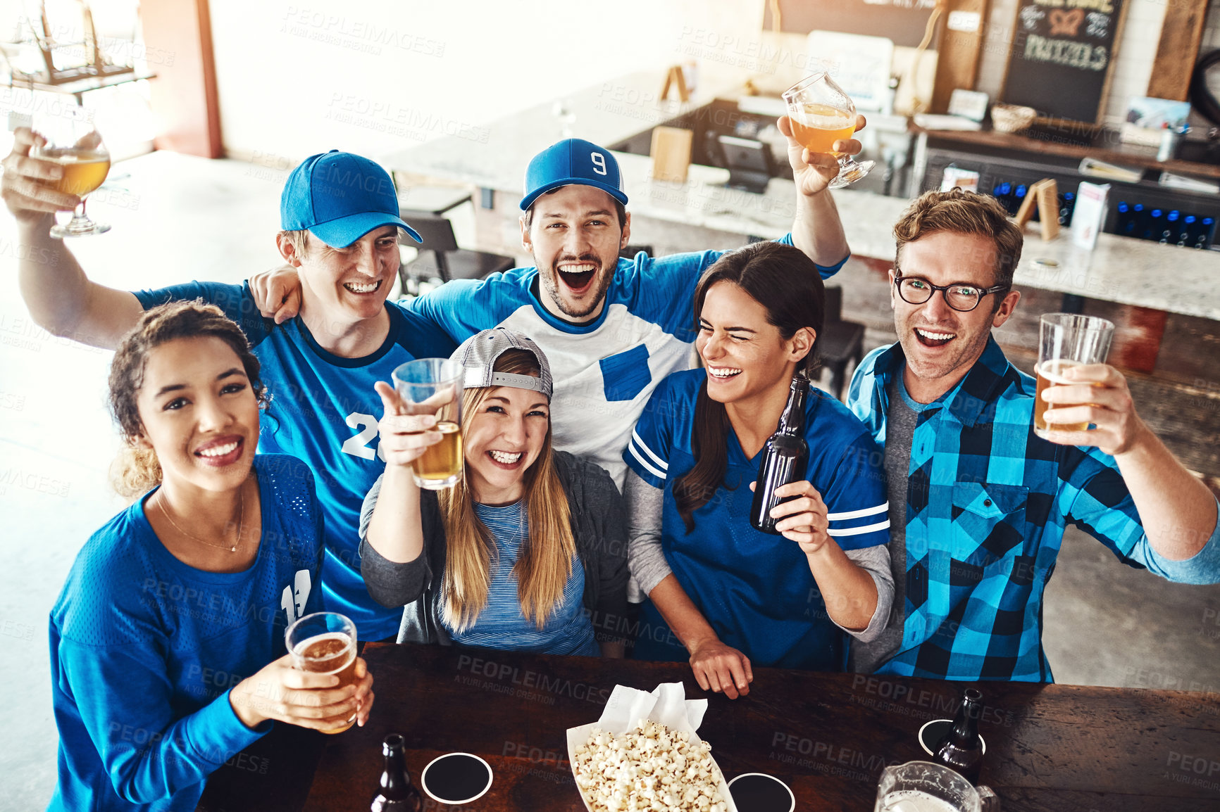 Buy stock photo Beer, portrait and sports fans in pub for winning game with goal for celebration in support together. Excited, cheering and friends drink alcohol and watch broadcast television of team match in bar.