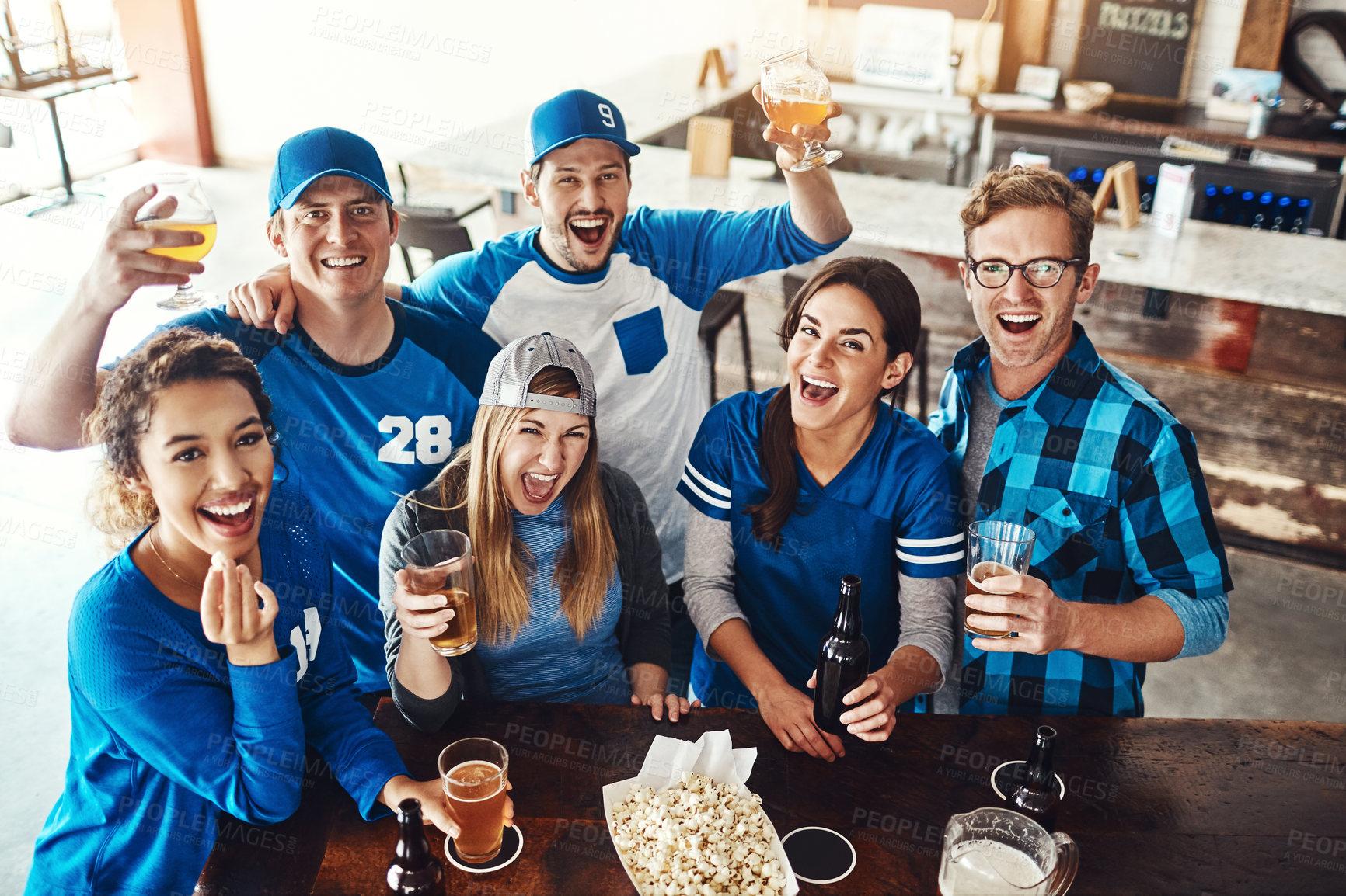 Buy stock photo Beer, sports and portrait of friends in pub for winning game with goal for celebration in support together. Excited, cheering and fans drink alcohol and watching broadcast tv of team match in bar.