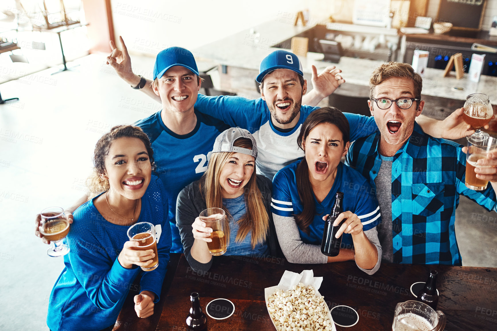 Buy stock photo Beer, sports and fans in pub for victory game with goal for celebration in support together. Excited, portrait and group of friends drink alcohol and people broadcast television of team match in bar.