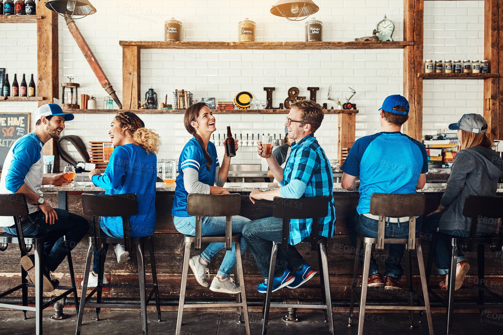 Buy stock photo Laughing, happy hour or people in sports pub with beer, popcorn or social celebration of competition together. Funny, game or group of friends in bar for party, alcohol or fans at diner for football