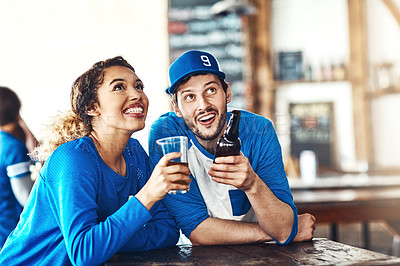 Buy stock photo Sports, tv or couple in pub with alcohol, smile or social celebration of competition together. Relax, soccer game or fun people in bar for watch party, beer drinks or fans at diner for happy hour