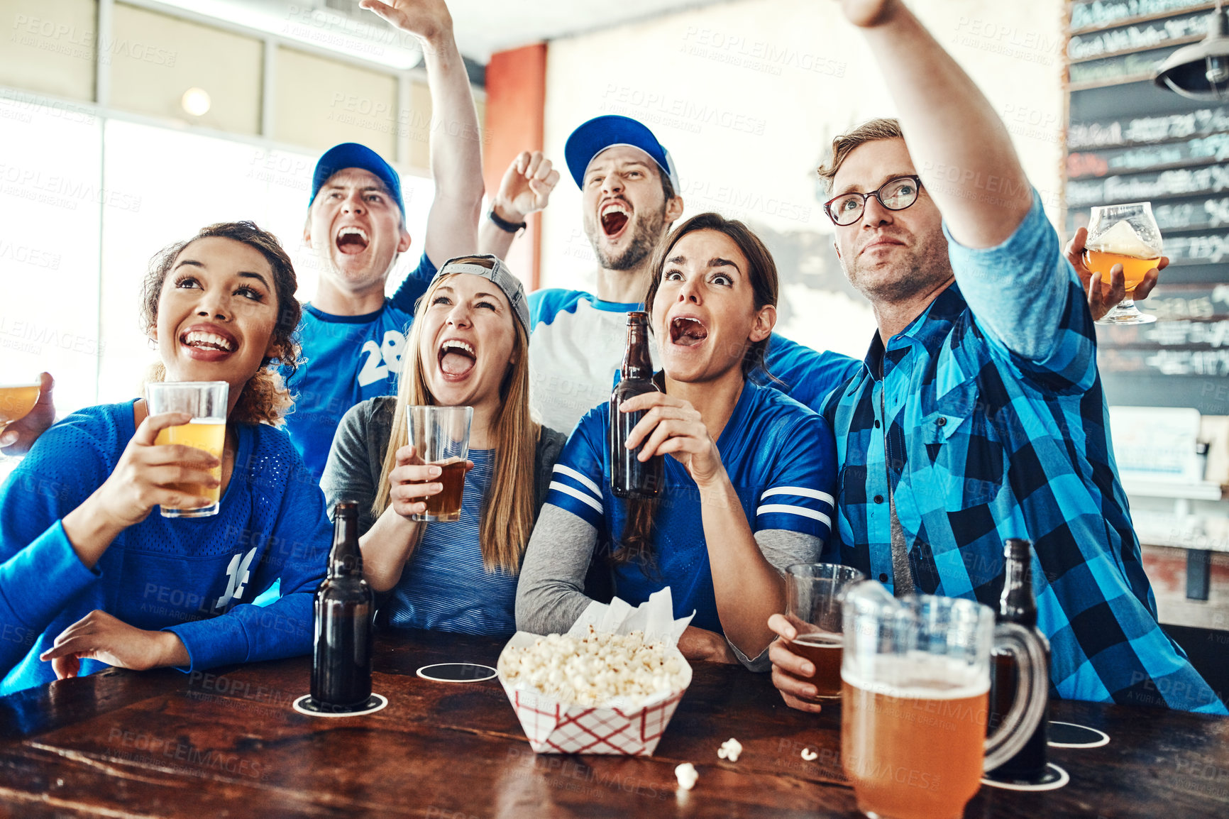 Buy stock photo Sports, goal or people in pub with beer, popcorn or social celebration for winning or score. Excited, game or group of friends in bar for watch party, alcohol drinks or fans at diner for happy hour