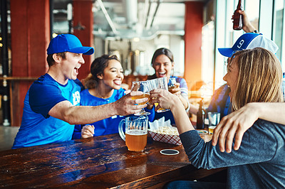 Buy stock photo Shot of a group of friends watching their favorite team live in a sports bar