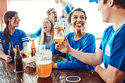 Buy stock photo Shot of a young woman and man having a conversation while drinking beer in a sports bar