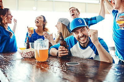 Buy stock photo Shot of people watching their favorite team live in a sports bar