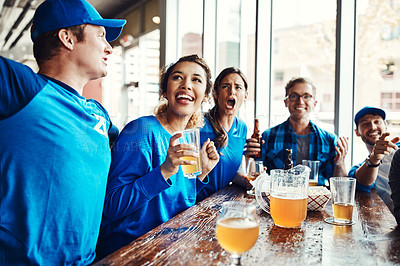 Buy stock photo Shot of people watching their favorite team live in a sports bar