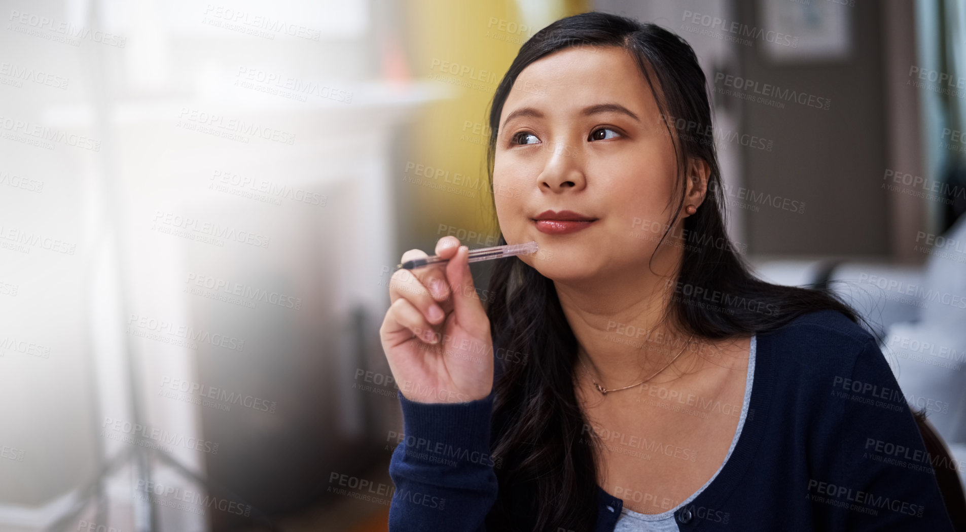 Buy stock photo Cropped shot of an attractive young female entrepreneur looking thoughtful while working from home