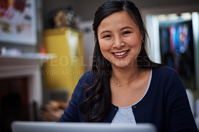 Buy stock photo Cropped portrait of an attractive young female entrepreneur working from home