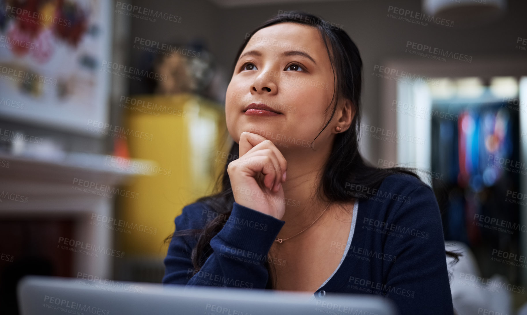 Buy stock photo Cropped shot of an attractive young female entrepreneur looking thoughtful while working from home