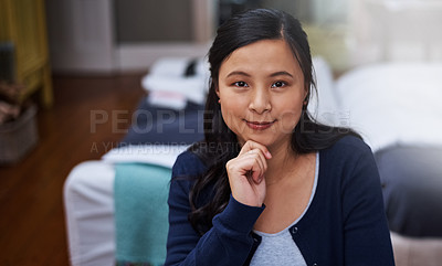 Buy stock photo Cropped portrait of an attractive young female entrepreneur looking thoughtful while working from home