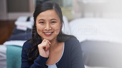 Buy stock photo Cropped portrait of an attractive young female entrepreneur looking thoughtful while working from home