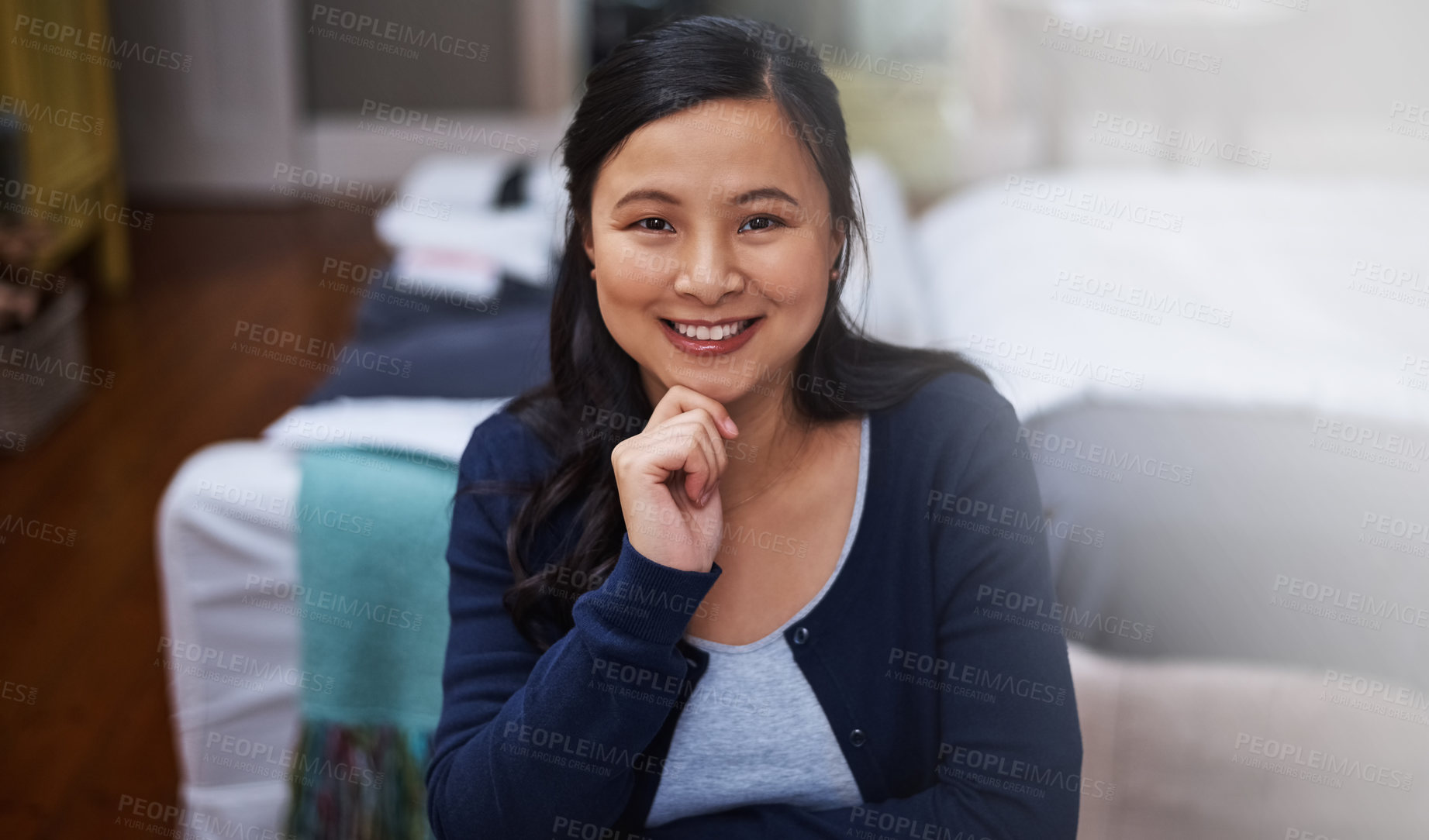 Buy stock photo Cropped portrait of an attractive young female entrepreneur looking thoughtful while working from home