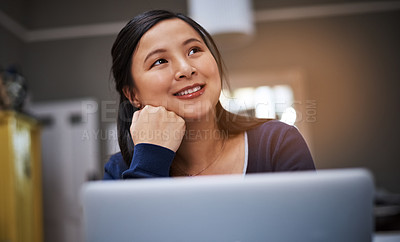 Buy stock photo Cropped shot of an attractive young female entrepreneur looking thoughtful while working from home