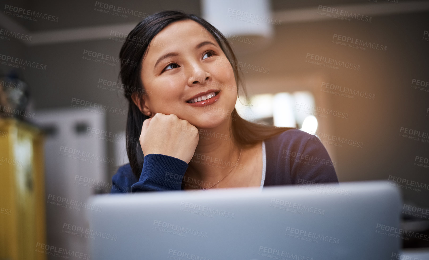 Buy stock photo Cropped shot of an attractive young female entrepreneur looking thoughtful while working from home