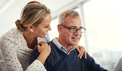 Buy stock photo Shot of a mature couple using a laptop together at home