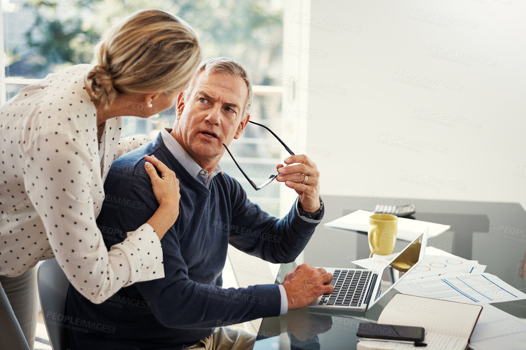 Buy stock photo Stress, couple and support with laptop in home for debt solution, budgeting or concern for bills. Space, mature people and serious with tech in house for loan application and review emergency savings