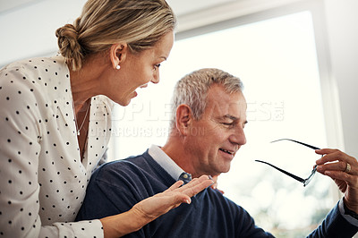 Buy stock photo Shot of a mature couple having  conversation at home