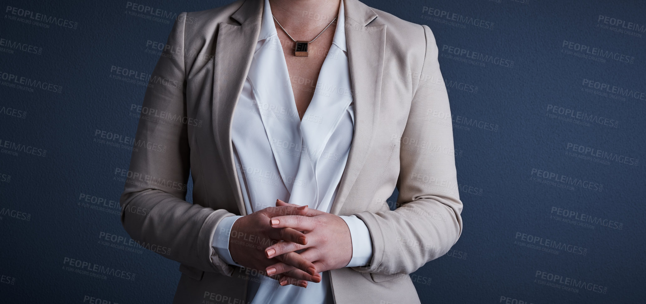 Buy stock photo Studio shot of an unrecognizable corporate businesswoman posing against a dark background