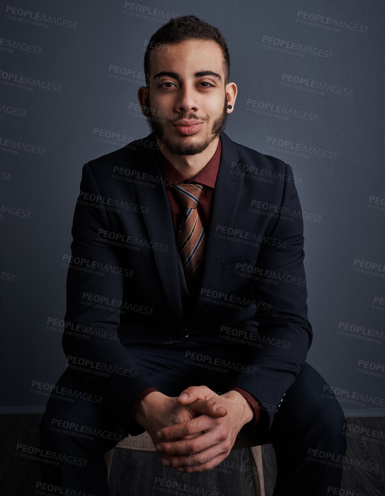 Buy stock photo Studio portrait of a stylish young businessman against a gray background