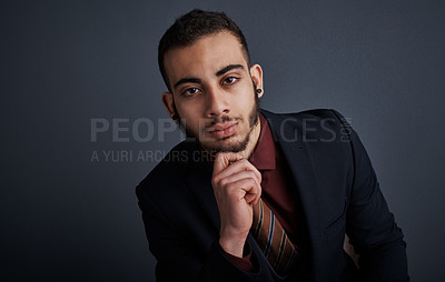 Buy stock photo Studio portrait of a stylish young businessman looking thoughtful against a gray background