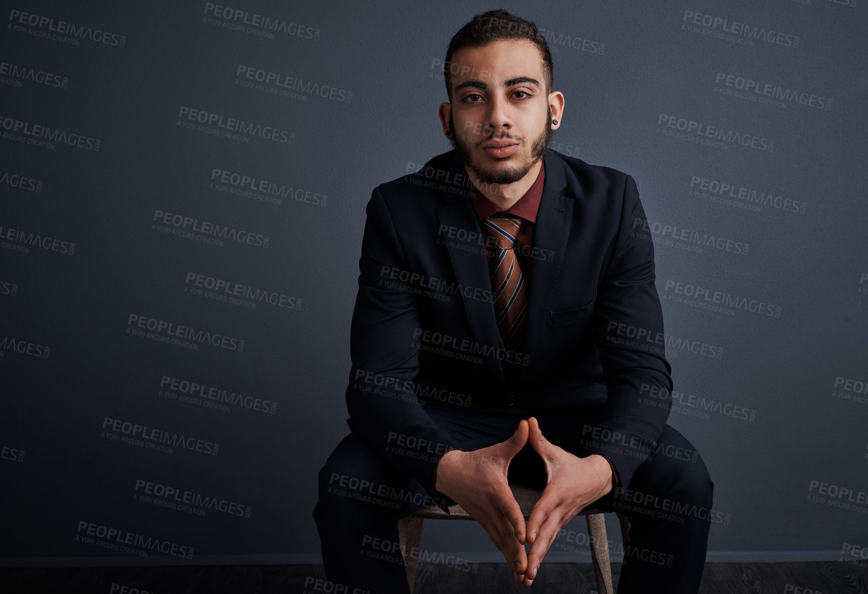 Buy stock photo Studio portrait of a stylish young businessman against a gray background