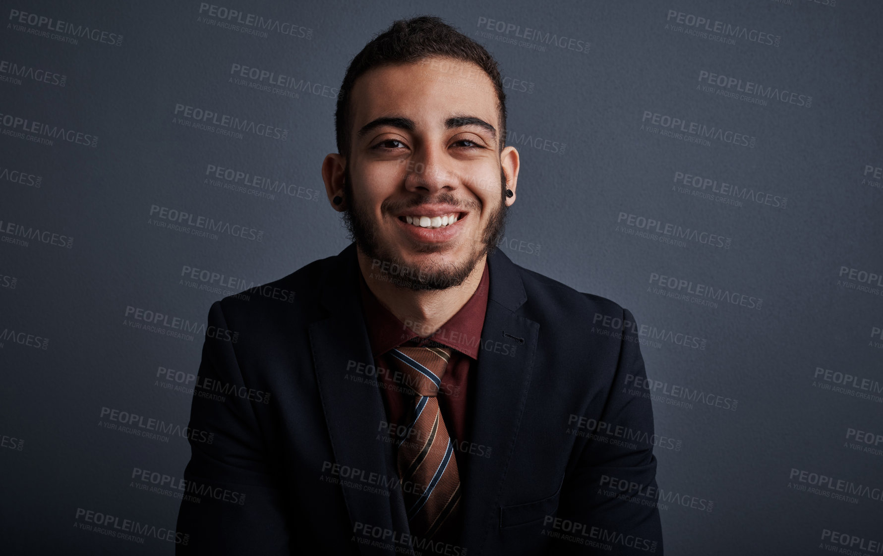 Buy stock photo Studio portrait of a stylish young businessman against a gray background