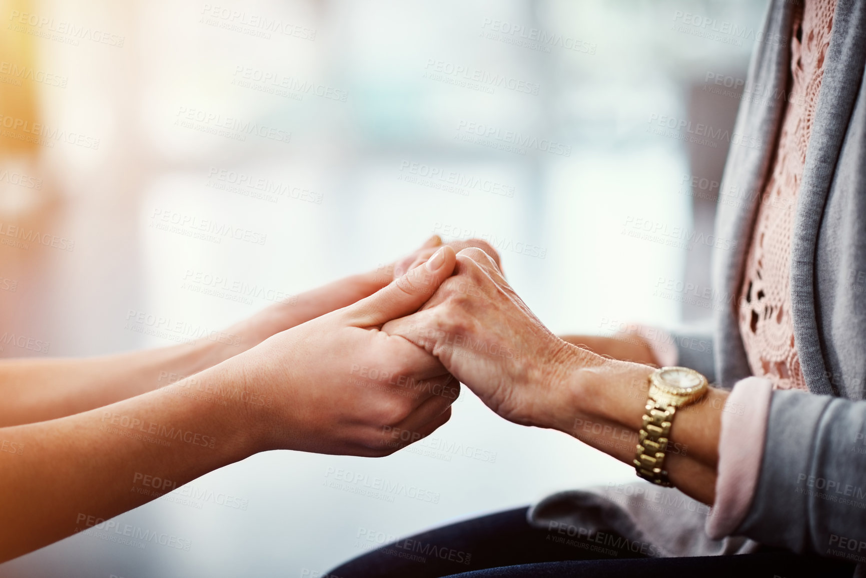 Buy stock photo Caregiver, holding hands or old woman in facility with comfort, support or empathy at checkup. Compassion, space or nurse in clinic with elderly patient, understanding or kindness in retirement care.