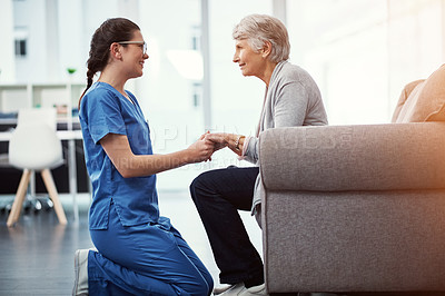 Buy stock photo Cropped shot of a young female nurse talking to her senior patient in the old age home