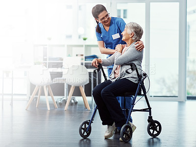 Buy stock photo Full length shot of a young female nurse talking to her senior patient in the old age home