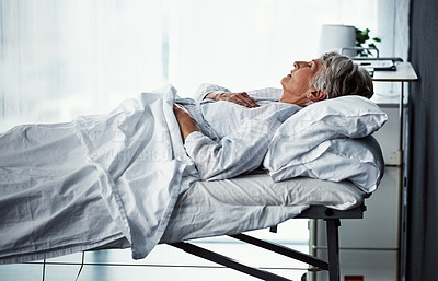 Buy stock photo Cropped shot of a sickly senior woman lying in a hospital bed