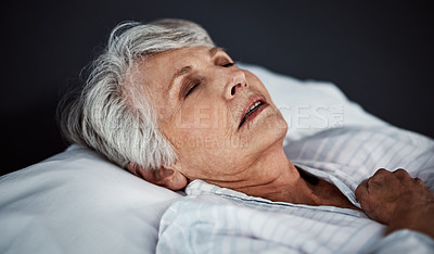 Buy stock photo High angle shot of a sickly senior woman lying in a hospital bed
