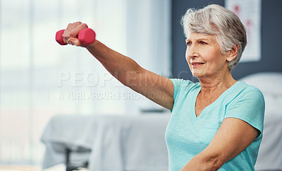 Buy stock photo Cropped shot of a senior woman working out with dumbbells