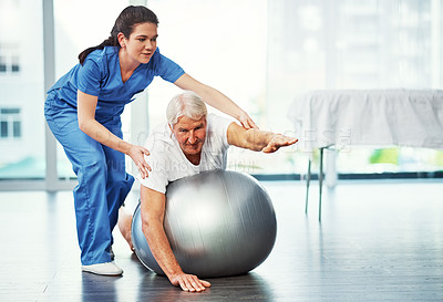 Buy stock photo Full length shot of a senior man working on his recovery with a female physiotherapist