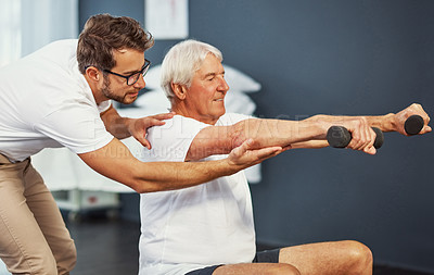 Buy stock photo Cropped shot of a senior man working on his recovery with a male physiotherapist