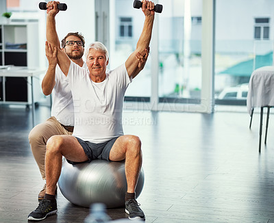 Buy stock photo Full length portrait of a senior man working on his recovery with a male physiotherapist