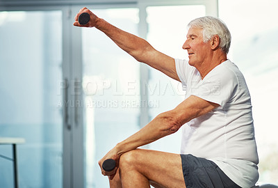 Buy stock photo Full length shot of a senior man working out with dumbbells as part of his recovery