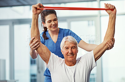 Buy stock photo Cropped portrait of a senior man working on his recovery with a female physiotherapist