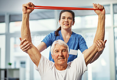 Buy stock photo Cropped shot of a senior man working on his recovery with a female physiotherapist