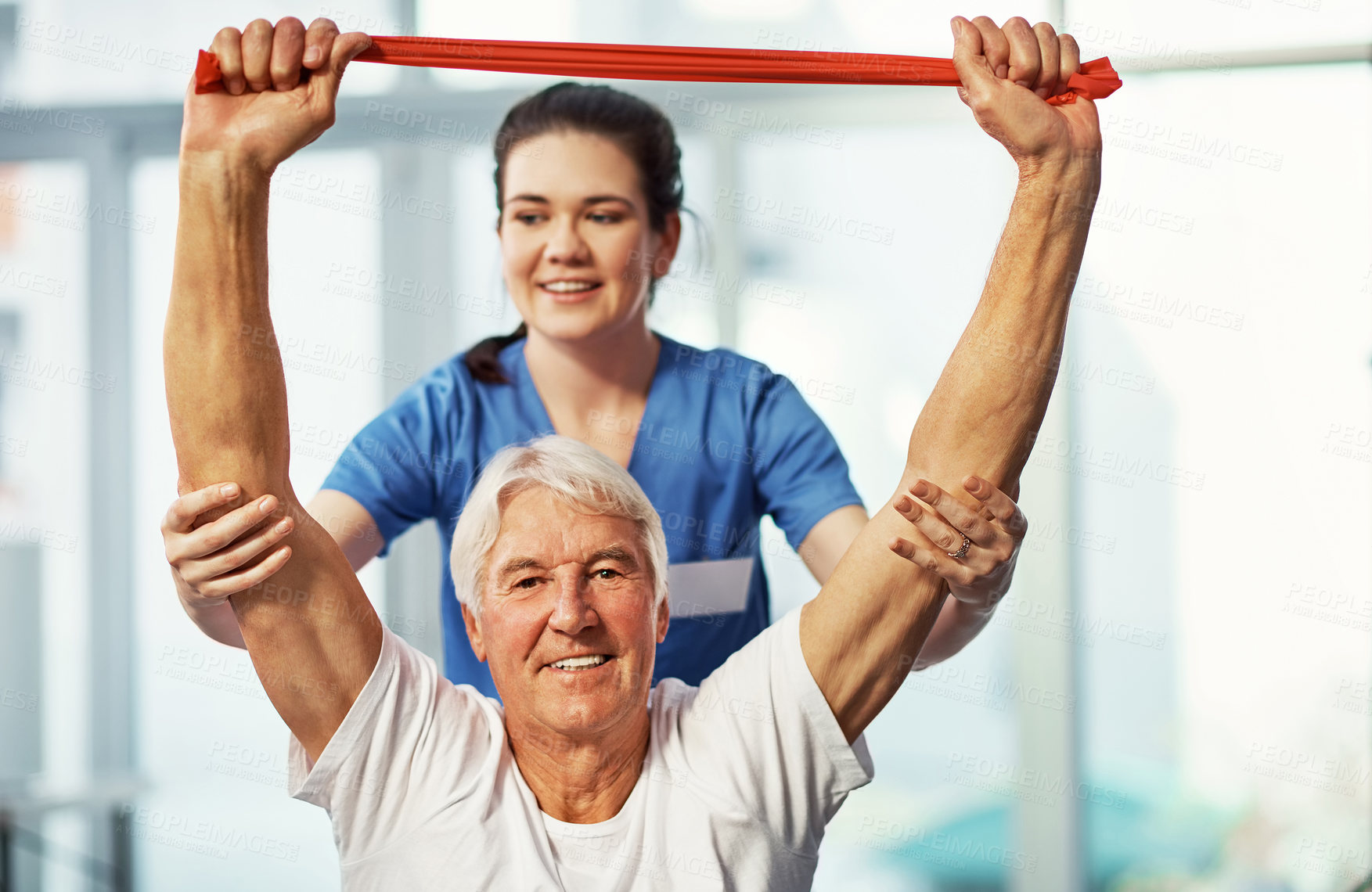 Buy stock photo Physiotherapist, senior man and resistance band with woman, help and rehabilitation in hospital. Chiropractor, nurse and portrait of elderly patient with support, smile and healthcare in clinic