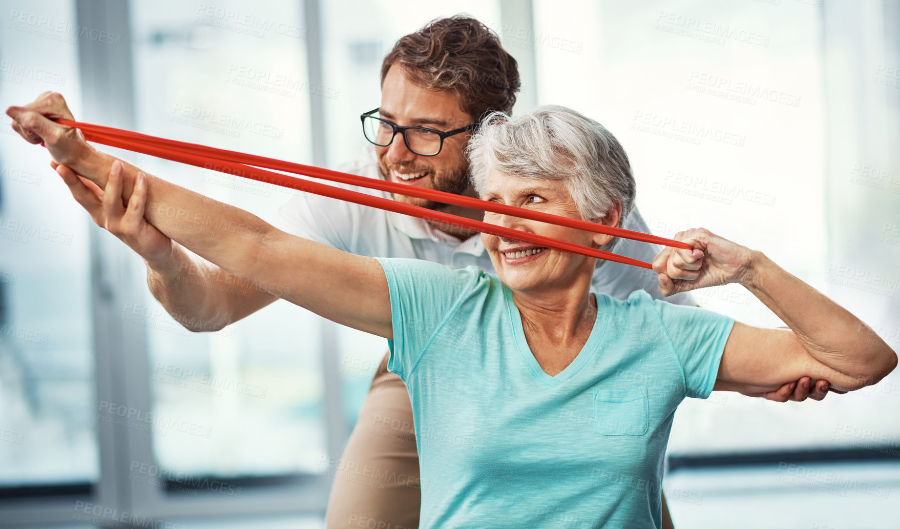 Buy stock photo Cropped shot of a senior woman working through her recovery with a male physiotherapist