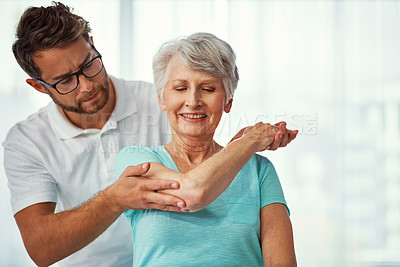 Buy stock photo Senior woman, stretching and help with physiotherapy for mobility, muscle exercise and recovery. Man, guidance and elderly person for physical therapy, injury assessment and healthcare rehabilitation