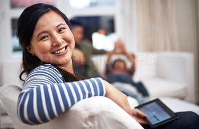 Buy stock photo Shot of a person using a digital tablet at home